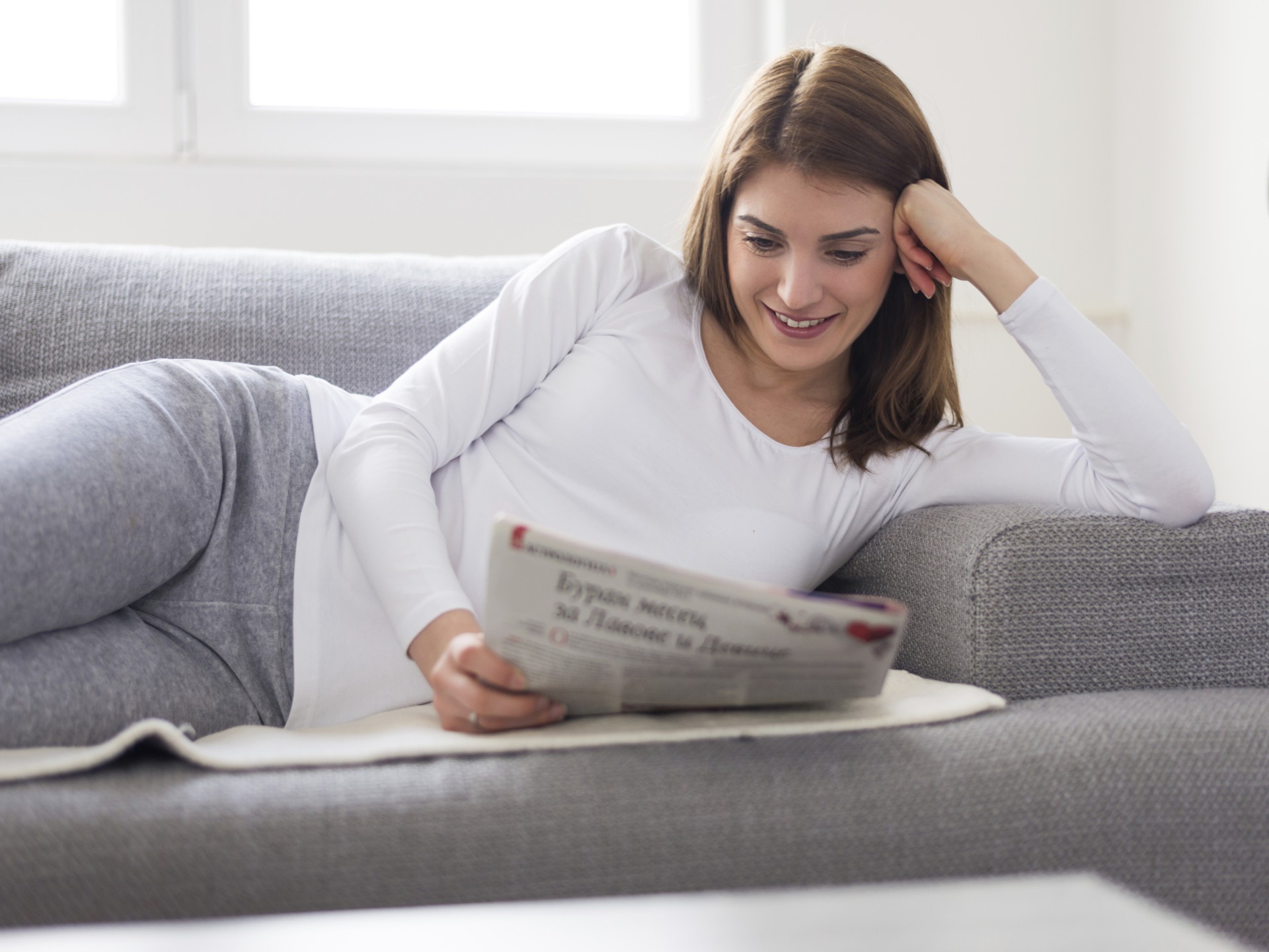 woman-white-newspaper-couch.jpg